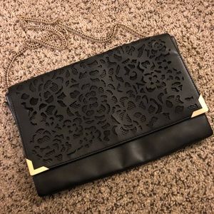 Black cutout gold accented clutch purse